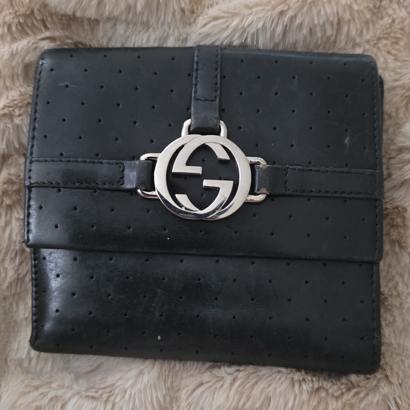 Authentic Gucci GG perforated leather wallet in classic black